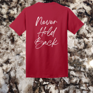Red t-shirt with 'Never Hold Back' slogan on the back, written in elegant white script for a motivational touch.